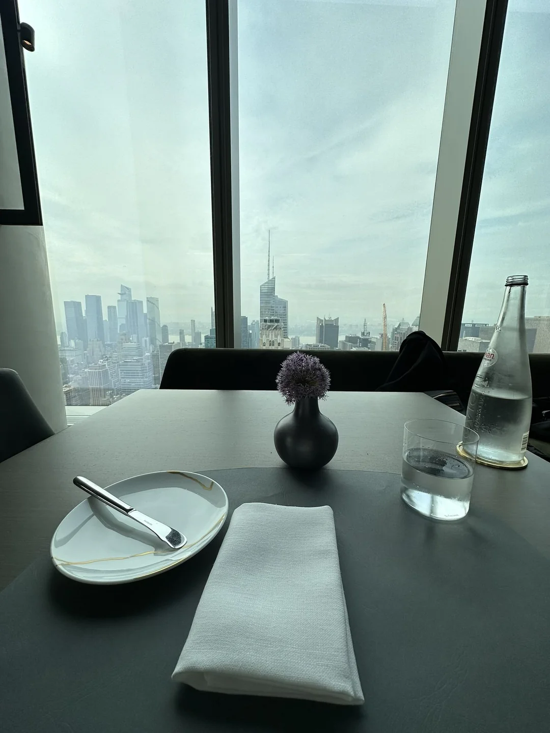 Table by the window with a view across Midtown