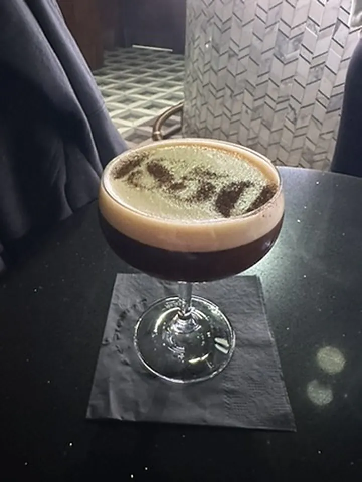 Espresso martini with the 1850 lettering in the speakeasy bar of the Centurion Lounge JFK